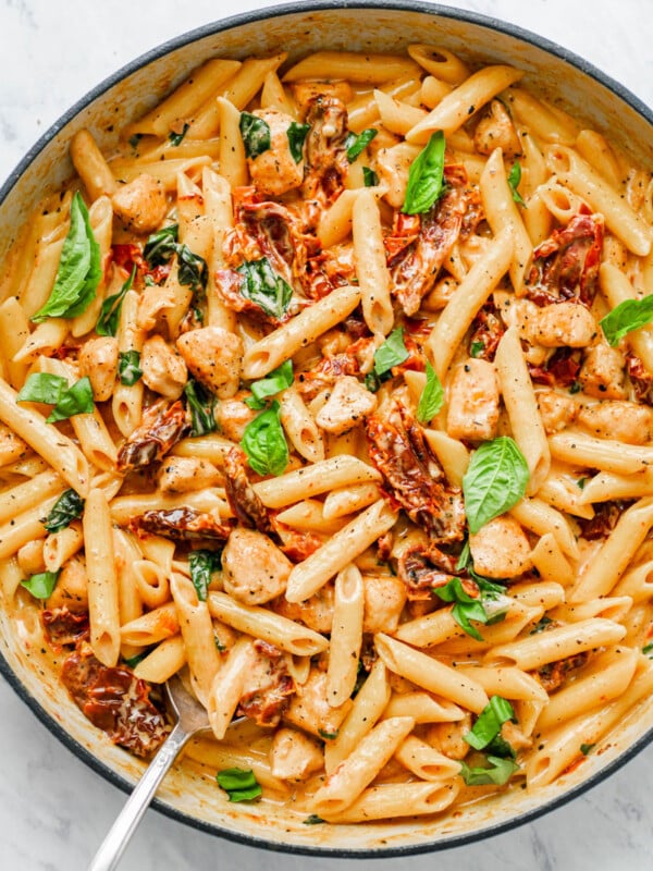 Creamy sun-dried tomato pasta in a pot.