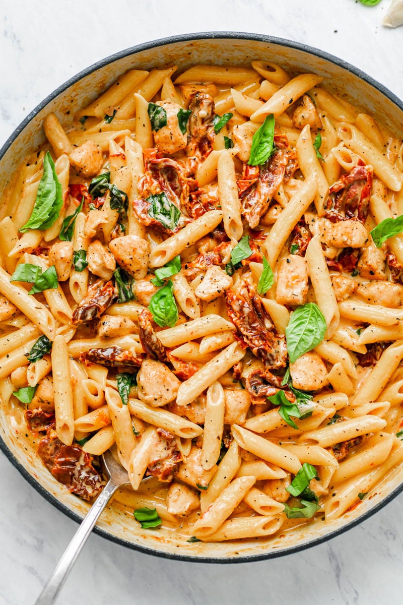 Creamy sun-dried tomato pasta in a pot.