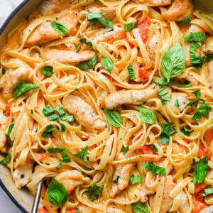 top down view of creamy tomato basil pasta in a skillet