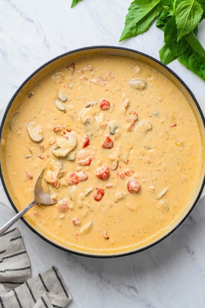 creamy tortellini sauce in a skillet