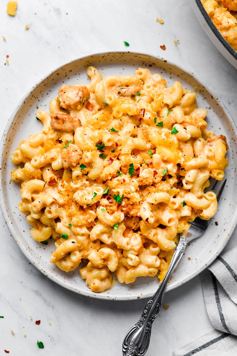 chicken mac and cheese served on a plate