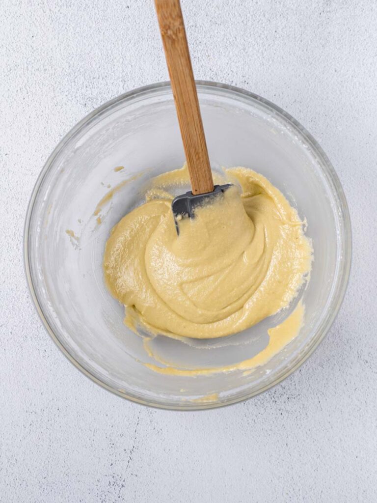 lemon macaron batter in a bowl