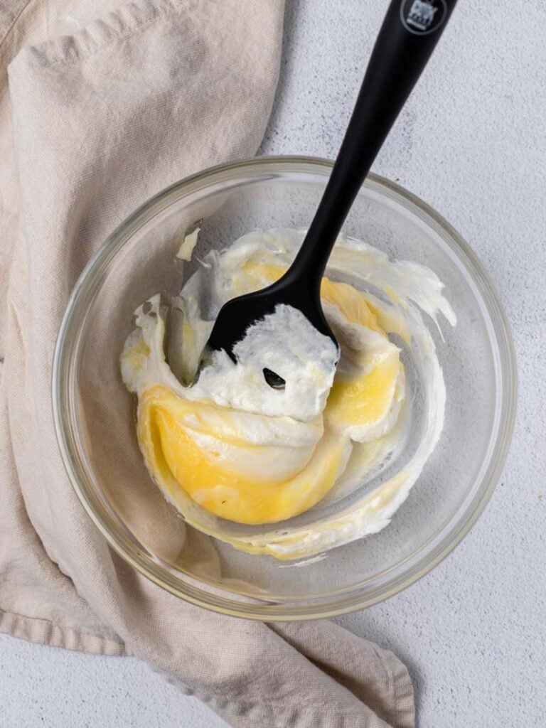 lemon macaron batter in a bowl