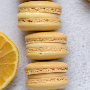 lemon macarons stacked on top of one another