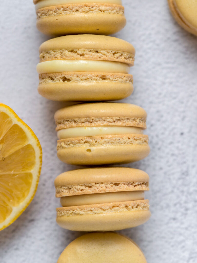 lemon macarons stacked on top of one another