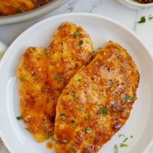 A plate of chicken with honey mustard sauce.