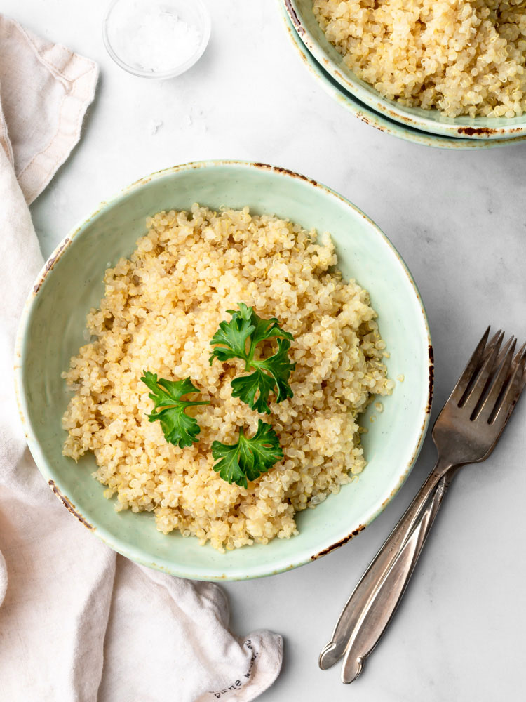 cooked quinoa in a plate garnished with parsley