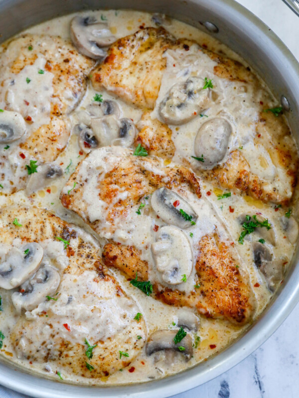 Overhead view of creamy mushroom chicken in a pot.