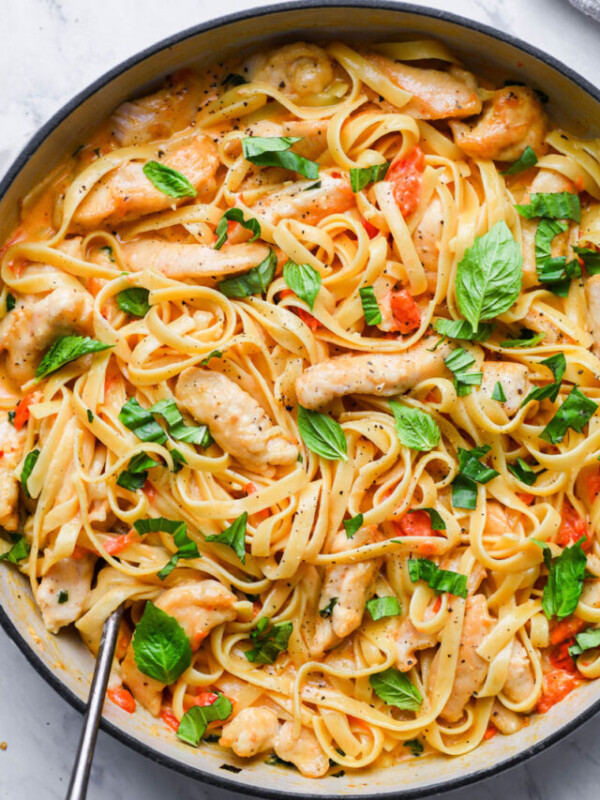 top down view of creamy tomato basil pasta in a skillet