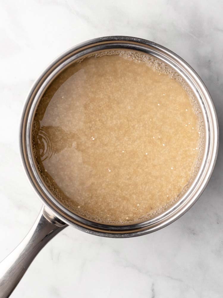 cooked quinoa with water in a pot