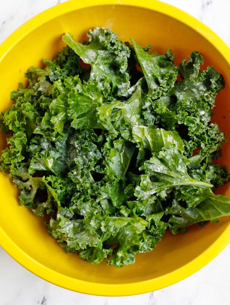 Kale leaves in a bowl to turn into chips.