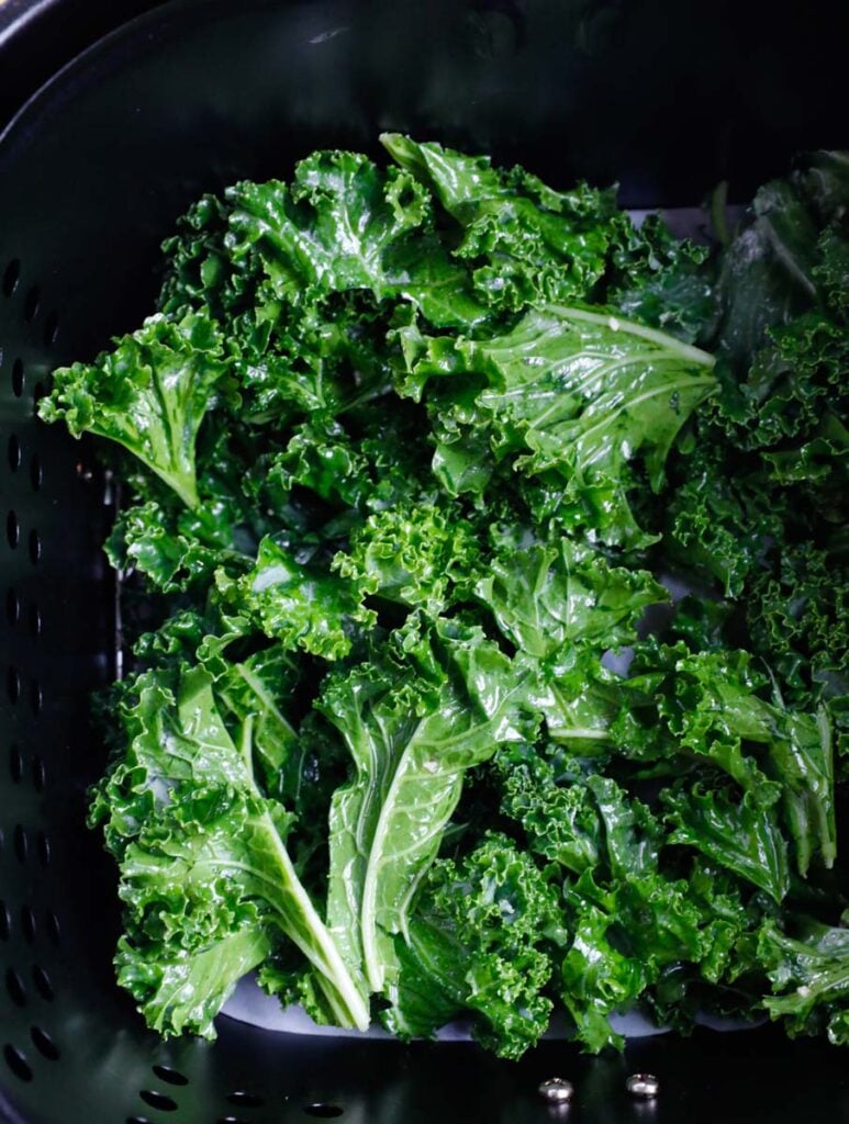 Kale leaves in an air fryer.