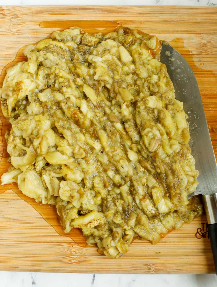 chopped roasted eggplant on a cutting board