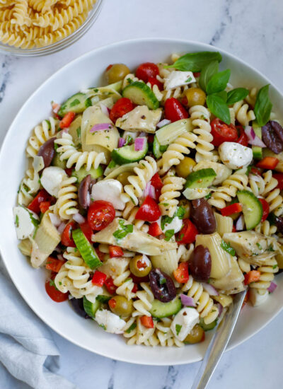 A Mediterranean pasta salad in a bowl.