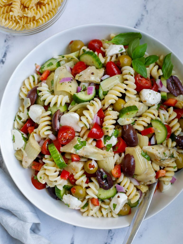 A Mediterranean pasta salad in a bowl.