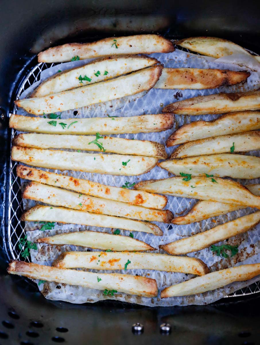 French fries inside an air fryer basket.