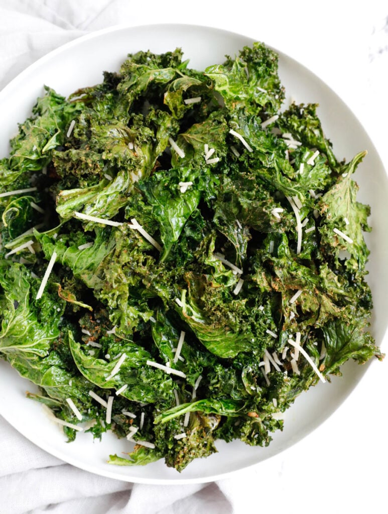 Crispy kale chips in a plate.