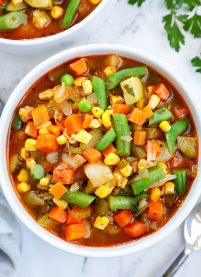 Overhead view of a bowl of vegetables soup.