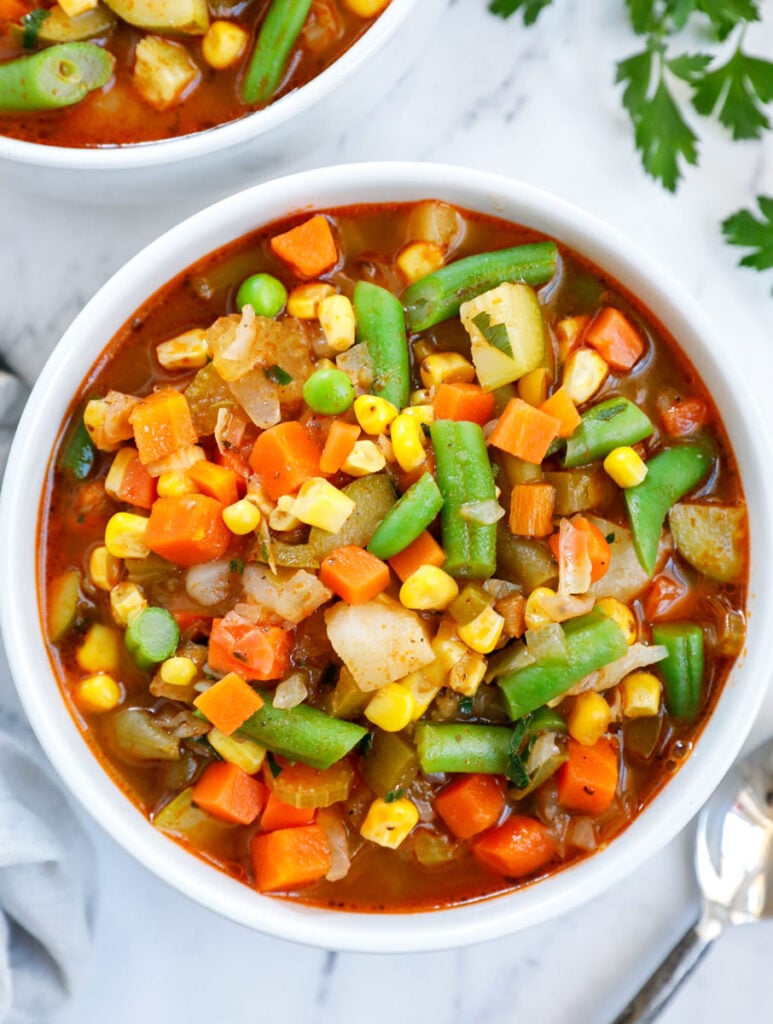 Overhead view of a bowl of vegetables soup.