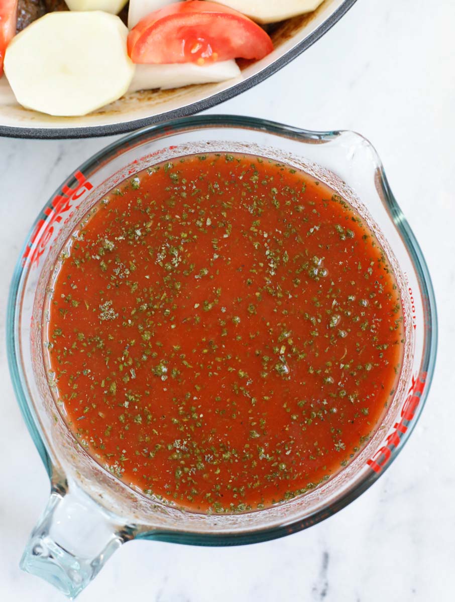 Making the sauce for kafta stew.