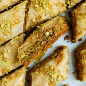 The inside of pistachio baklava, showing the layers of pastry.