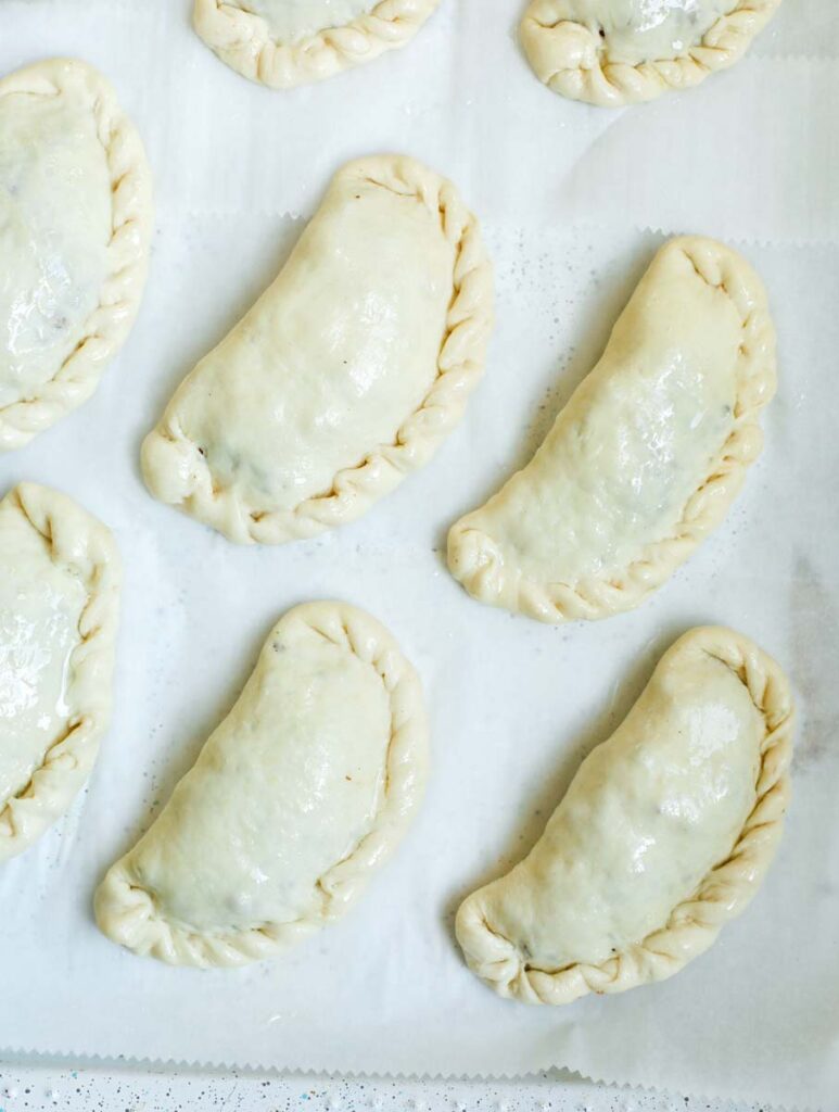 Shaped pie dough folded with the meat filling.