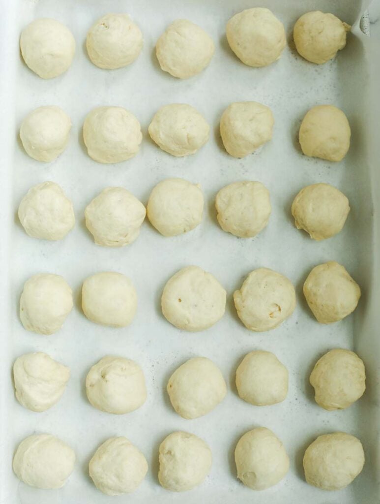 Hand held meat pie dough rolled out into small dough balls.