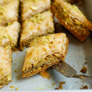 Close up of a pistachio baklava in a baking pan.