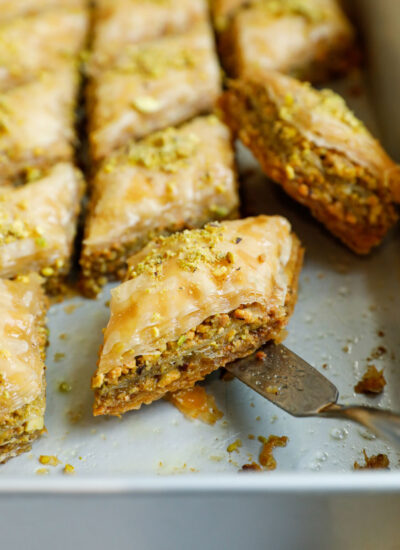 Close up of a pistachio baklava in a baking pan.