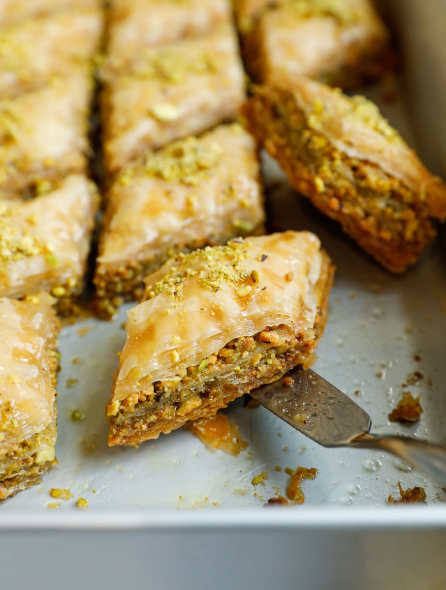 Close up of a pistachio baklava in a baking pan.