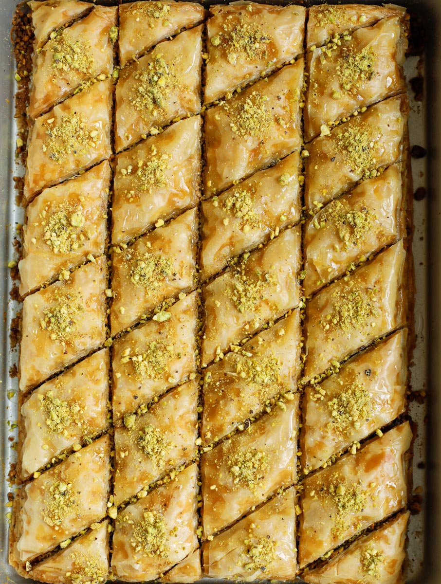 Baked pistachio baklava recipe with crushed pistachios on top.