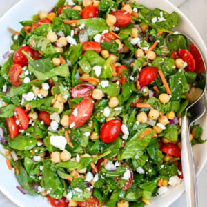 A plate of chickpea and spinach salad.