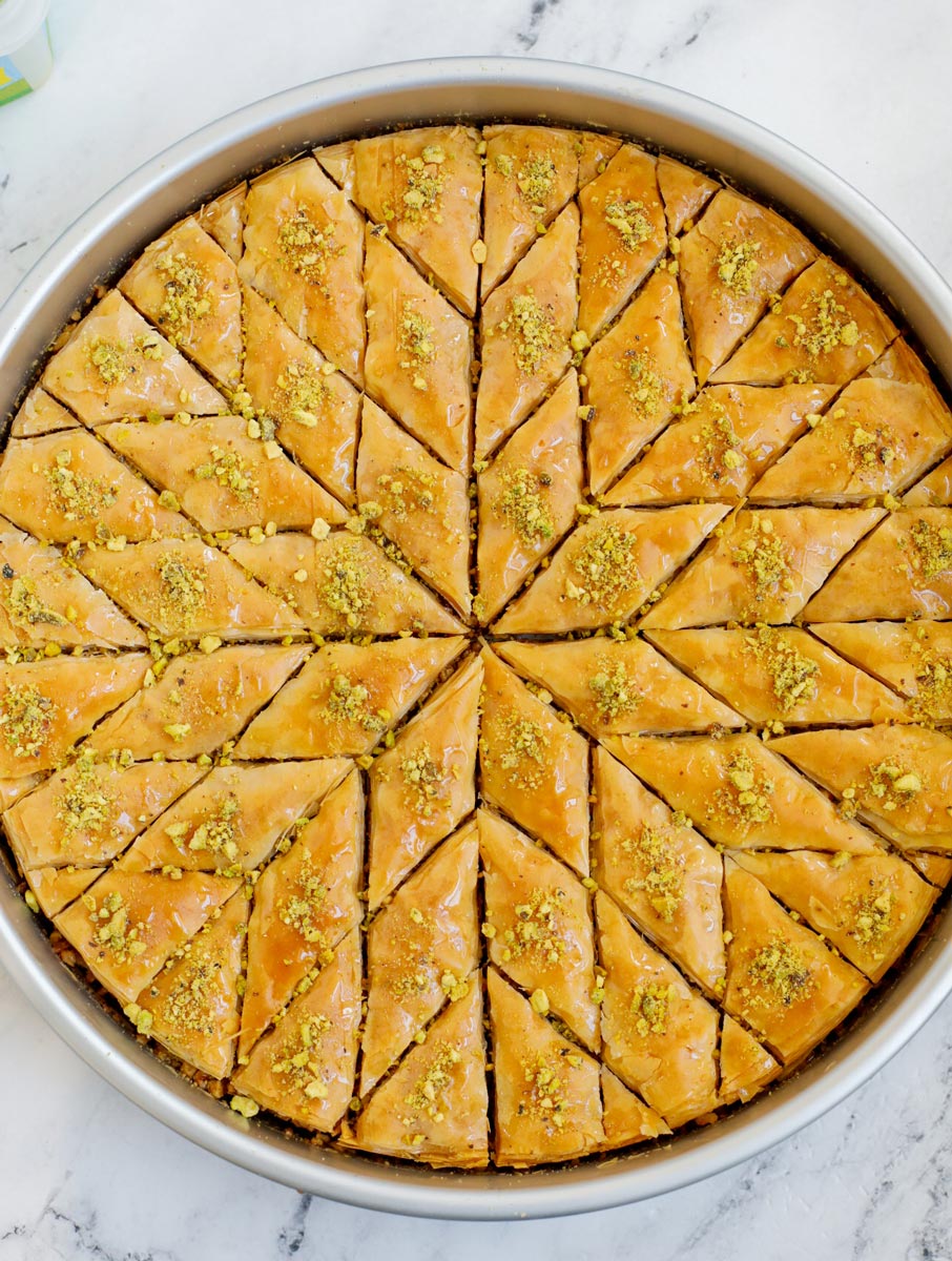 Baked walnut baklava cut into diamond shapes.