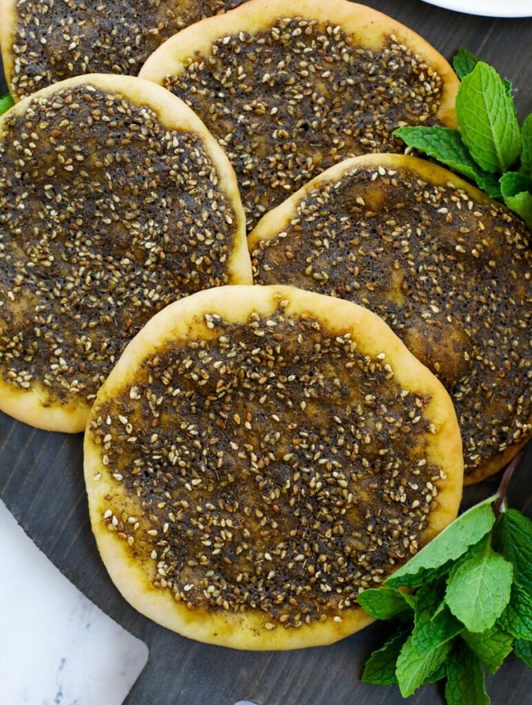 close up shot of zaatar manakeesh on a dark board