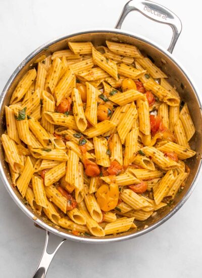 cherry tomato pesto pasta in a skillet