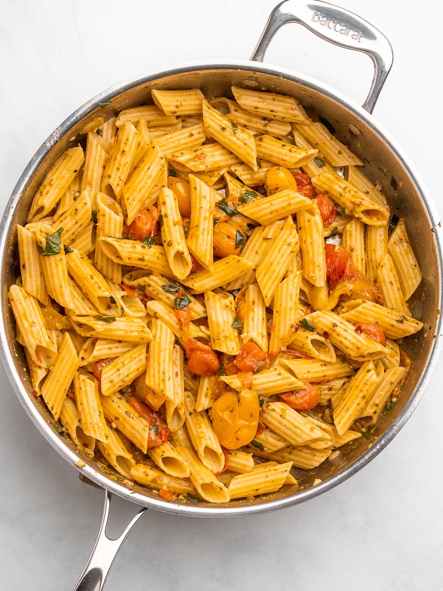 cherry tomato pesto pasta in a skillet