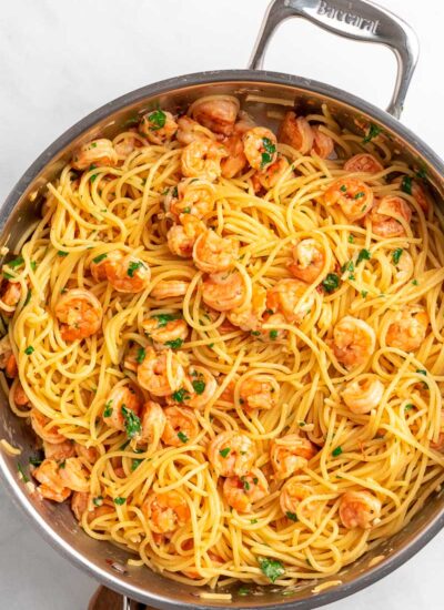 top down shot of shrimp spaghetti in a skillet