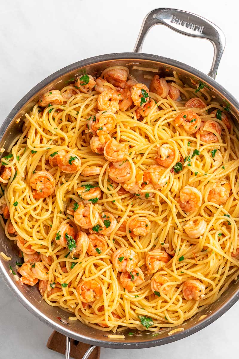 top down shot of shrimp spaghetti in a skillet