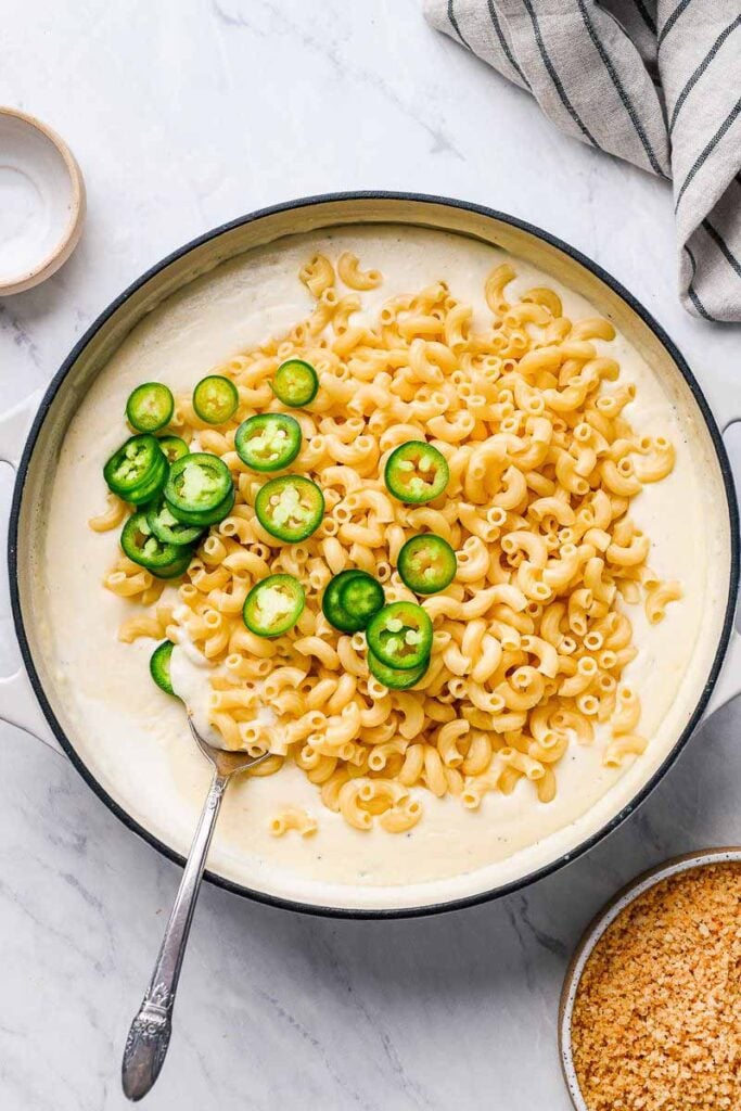 pasta and jalapeno pepper in a pan with sauce