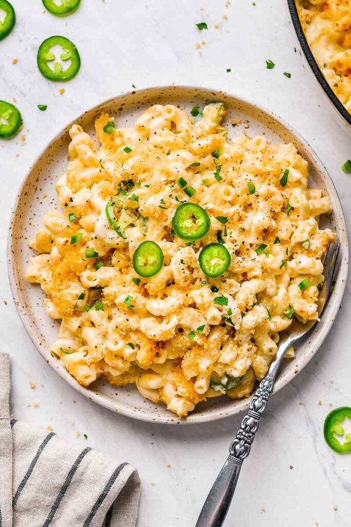 jalapeno mac n cheese served on a plate with a fork on the plate