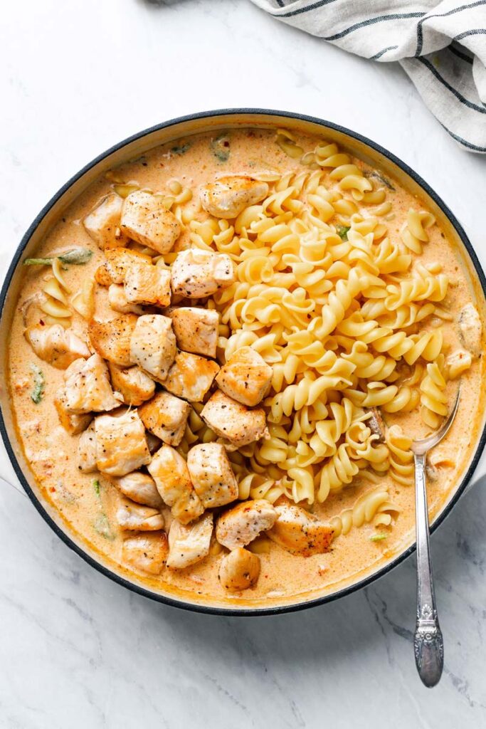 chicken and pasta in skillet with creamy mushroom sauce