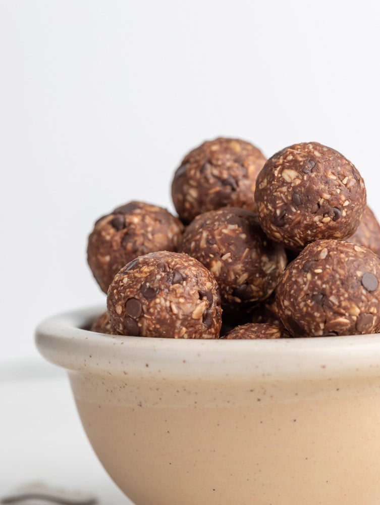 side shot of almond joy energy balls in a bowl