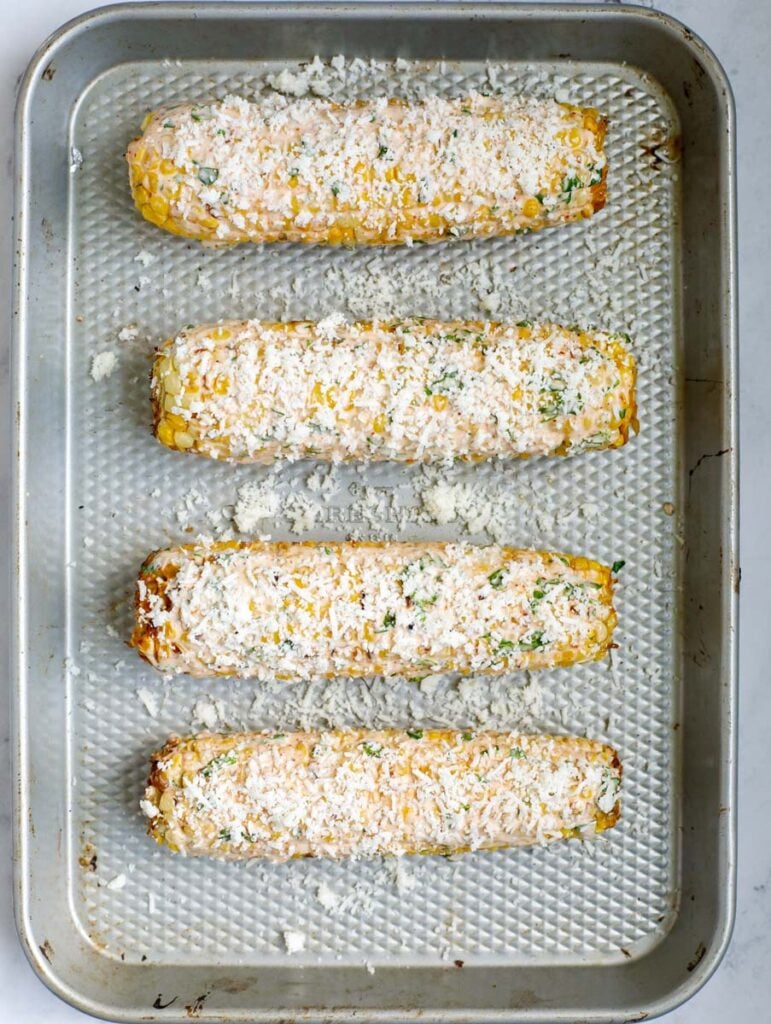 Mexican street corn sauce with cotija cheese on top.