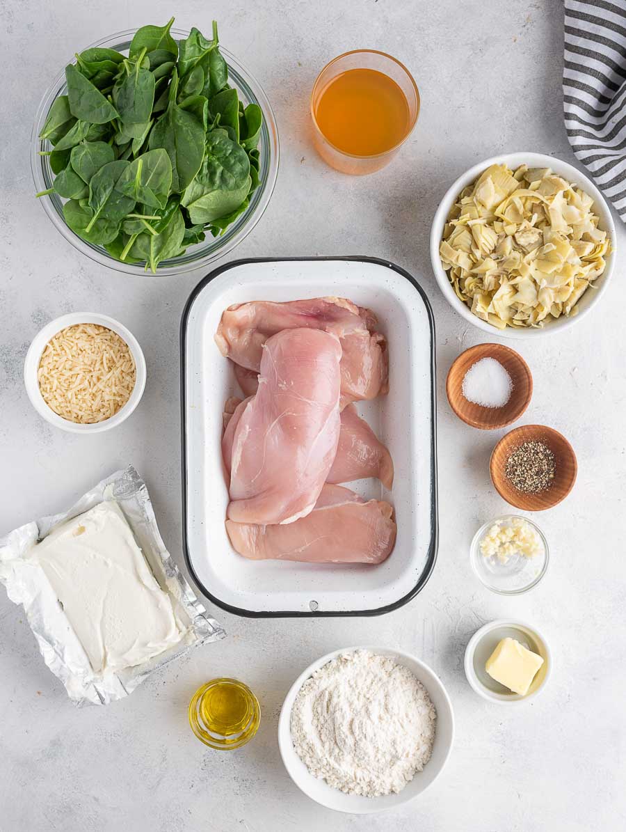 ingredients of spinach artichoke chicken laid out