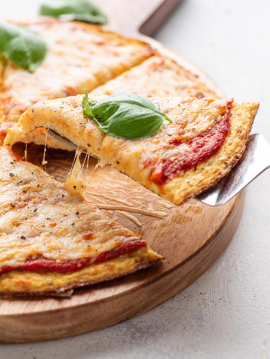 piece of pizza being lifted with a spatula