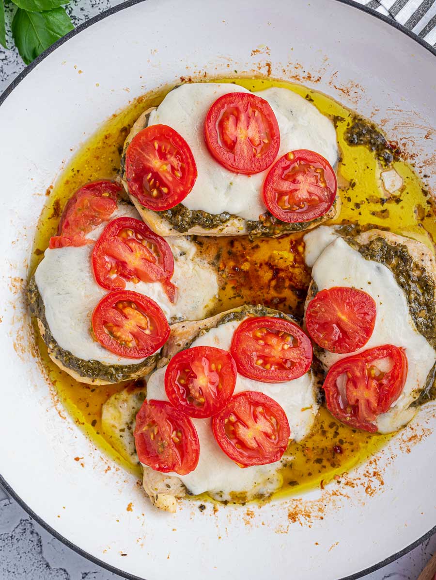 top down shot of chicken caprese after baking but before adding balsamic glaze