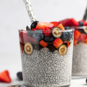 Creamy chia pudding topped with fresh strawberries and blueberries.