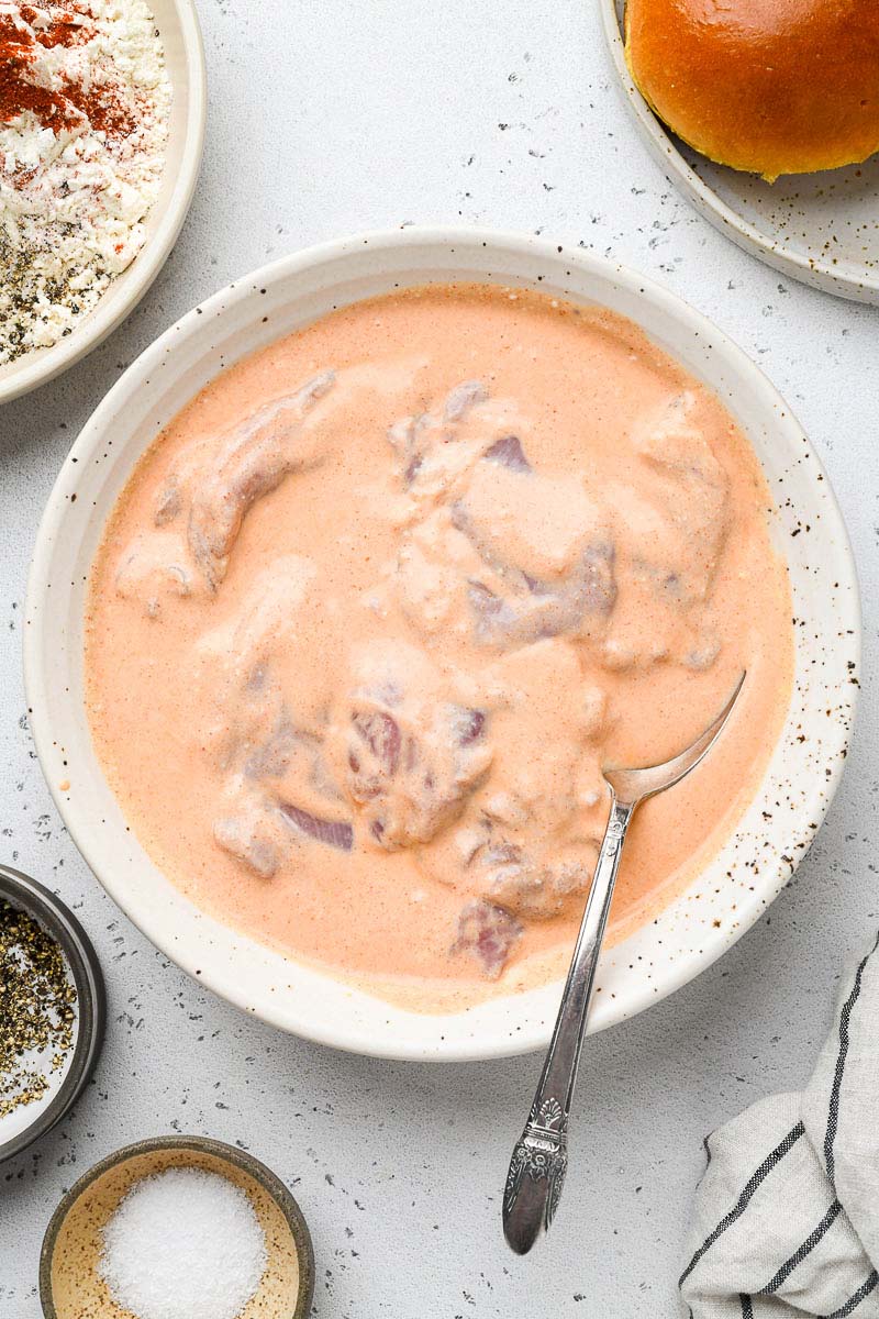 Chicken thighs in a buttermilk marinade.