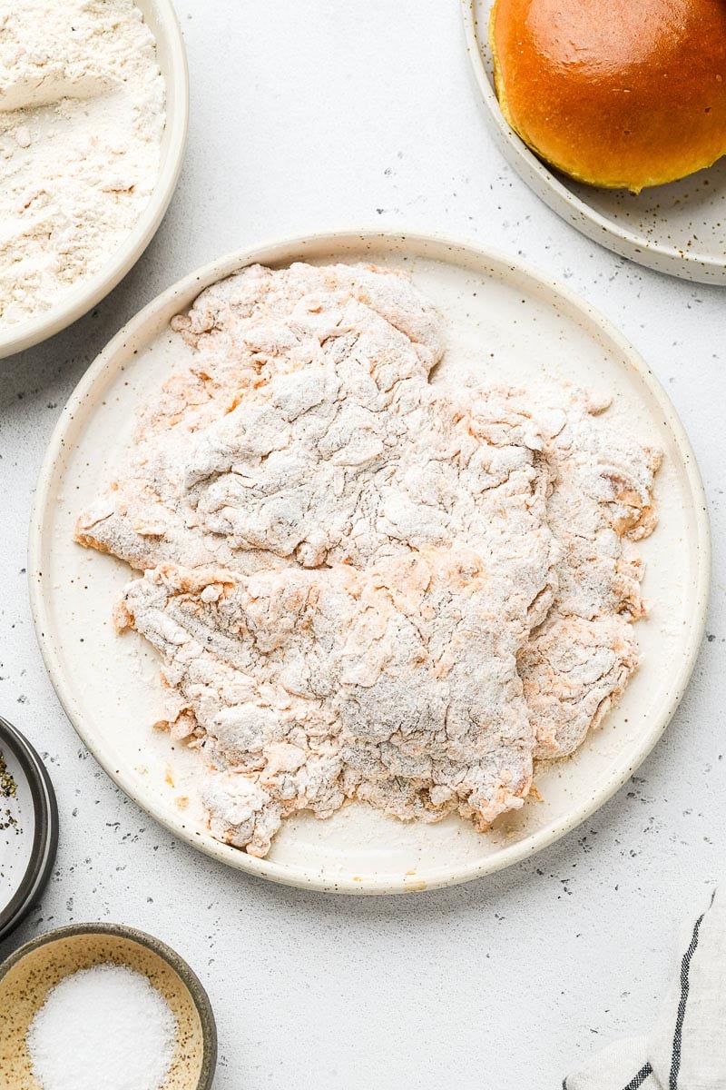 Chicken thighs coated in flour.