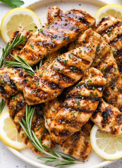 Close up of a plate of grilled honey mustard chicken.